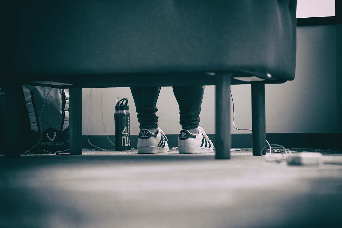 united states grayscale photo of person wearing adidas Superstar sitting down chicago